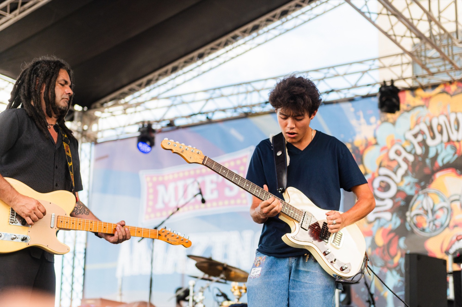 Dylan Miles trading guitar parts on the NOLA Funk Fest stage